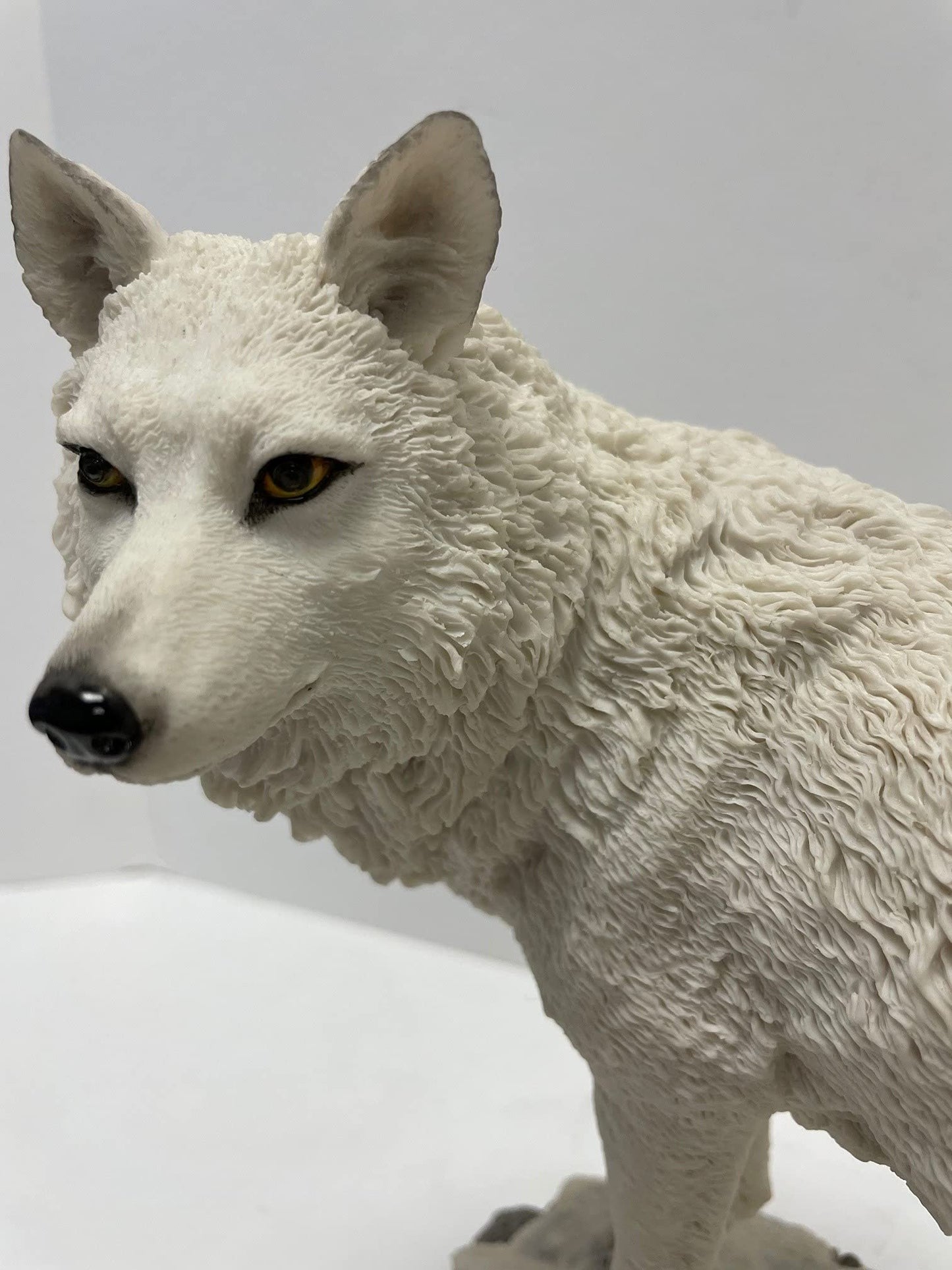 9.5 Inch Wolf on Snowy Ground Looking Back Statue Figurine, White