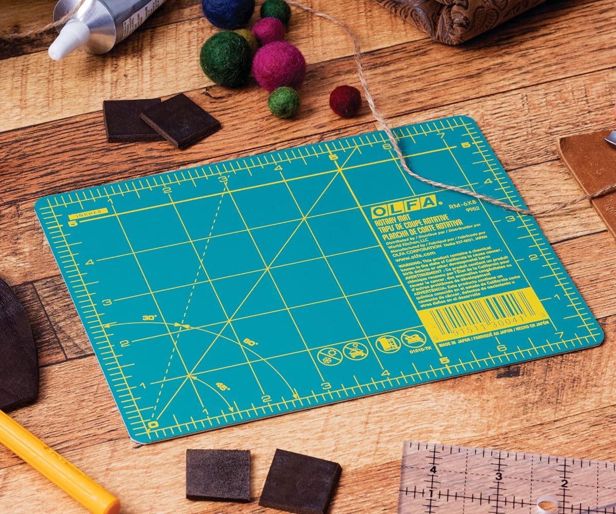 OLFA Self Healing Rotary Cutting Mat - Double Sided Cutting Mat with Grid for Quilting, Sewing, Fabric, & Crafts, Designed for Use with Rotary Cutters