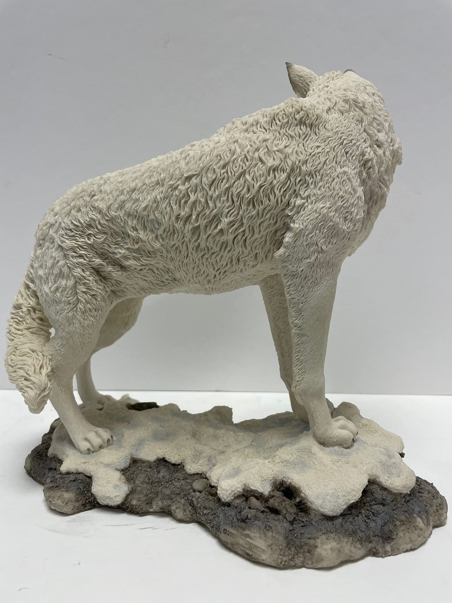 9.5 Inch Wolf on Snowy Ground Looking Back Statue Figurine, White