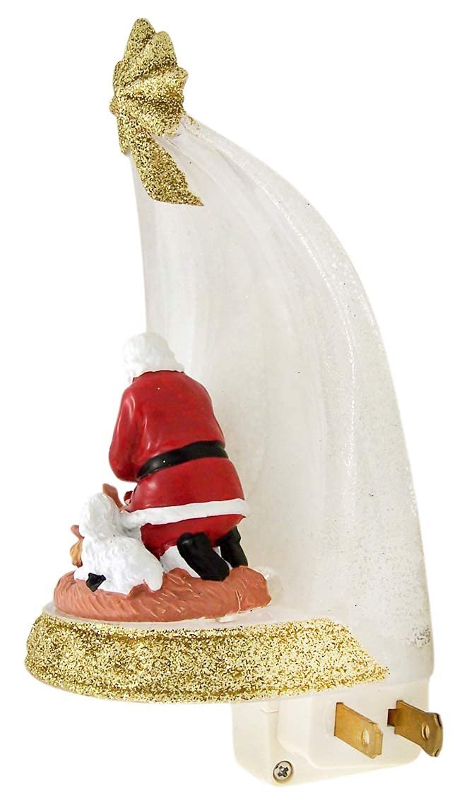 Roman Santa Claus Kneeling Before Baby Jesus in Manger Night Light