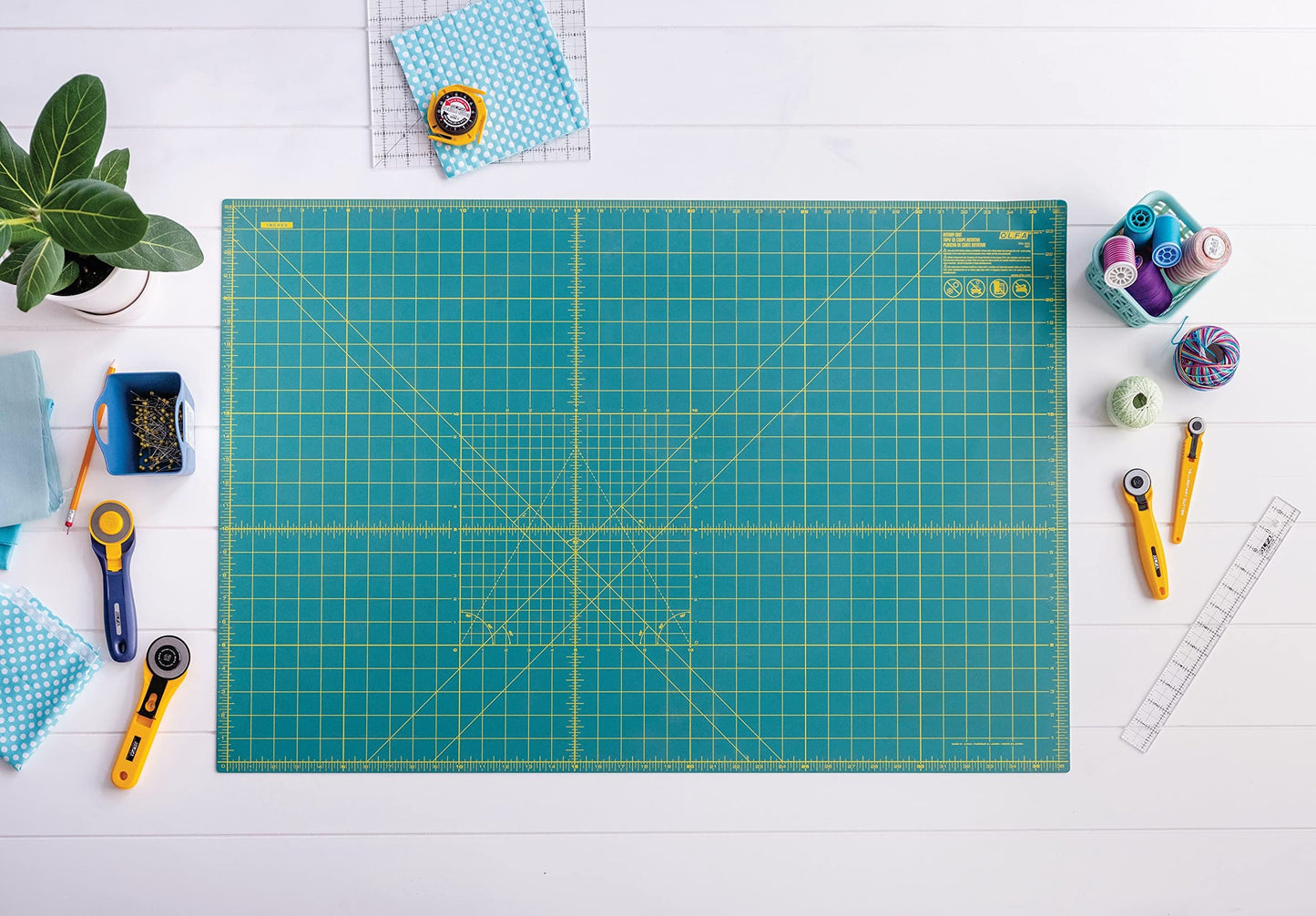 OLFA 24" x 36" Self Healing Rotary Cutting Mat (RM-MG) - Double Sided 24x36 Inch Cutting Mat with Grid for Quilting, Sewing, Fabric, & Crafts, Designed for Use with Rotary Cutters (Green)
