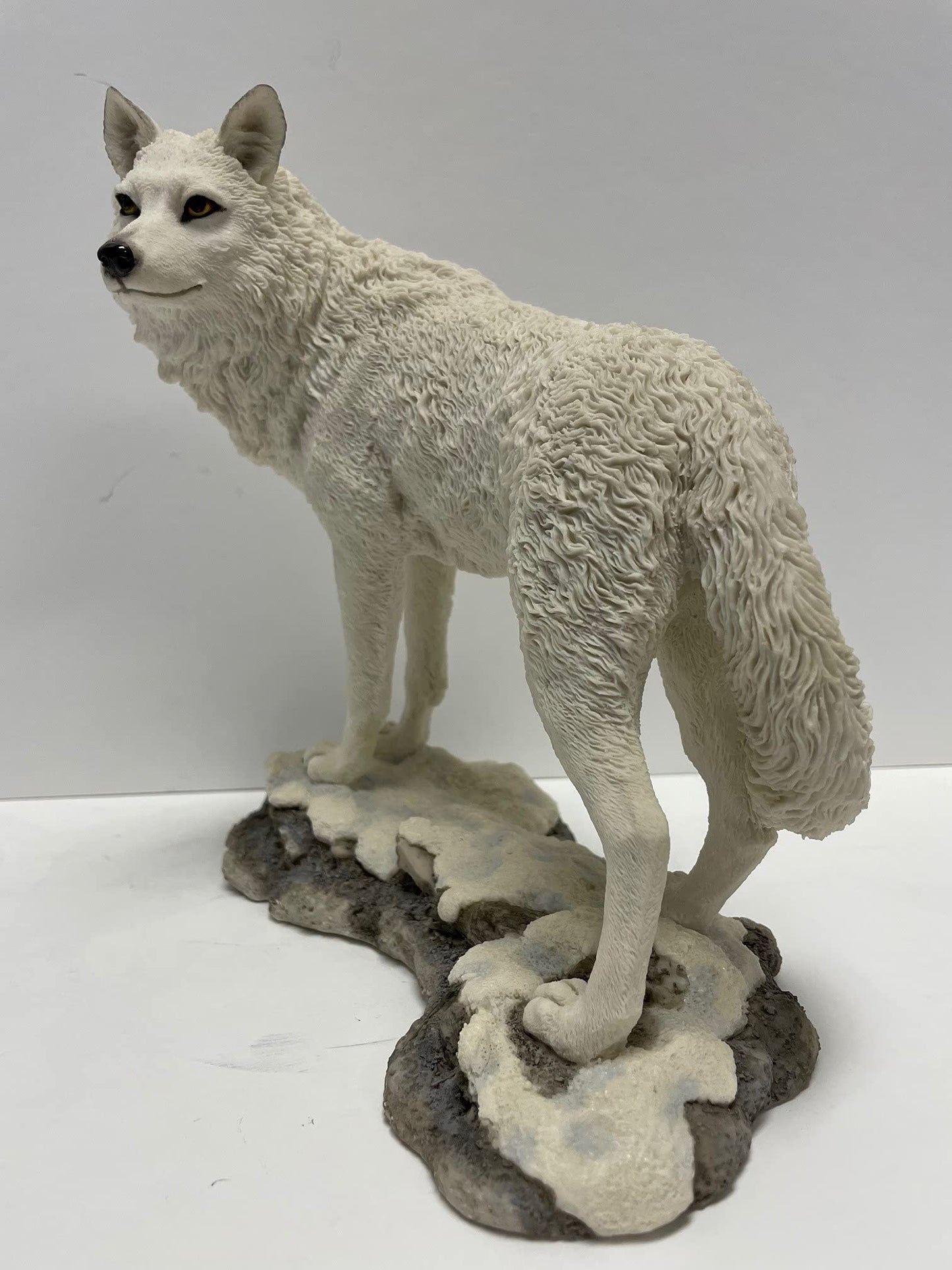 9.5 Inch Wolf on Snowy Ground Looking Back Statue Figurine, White