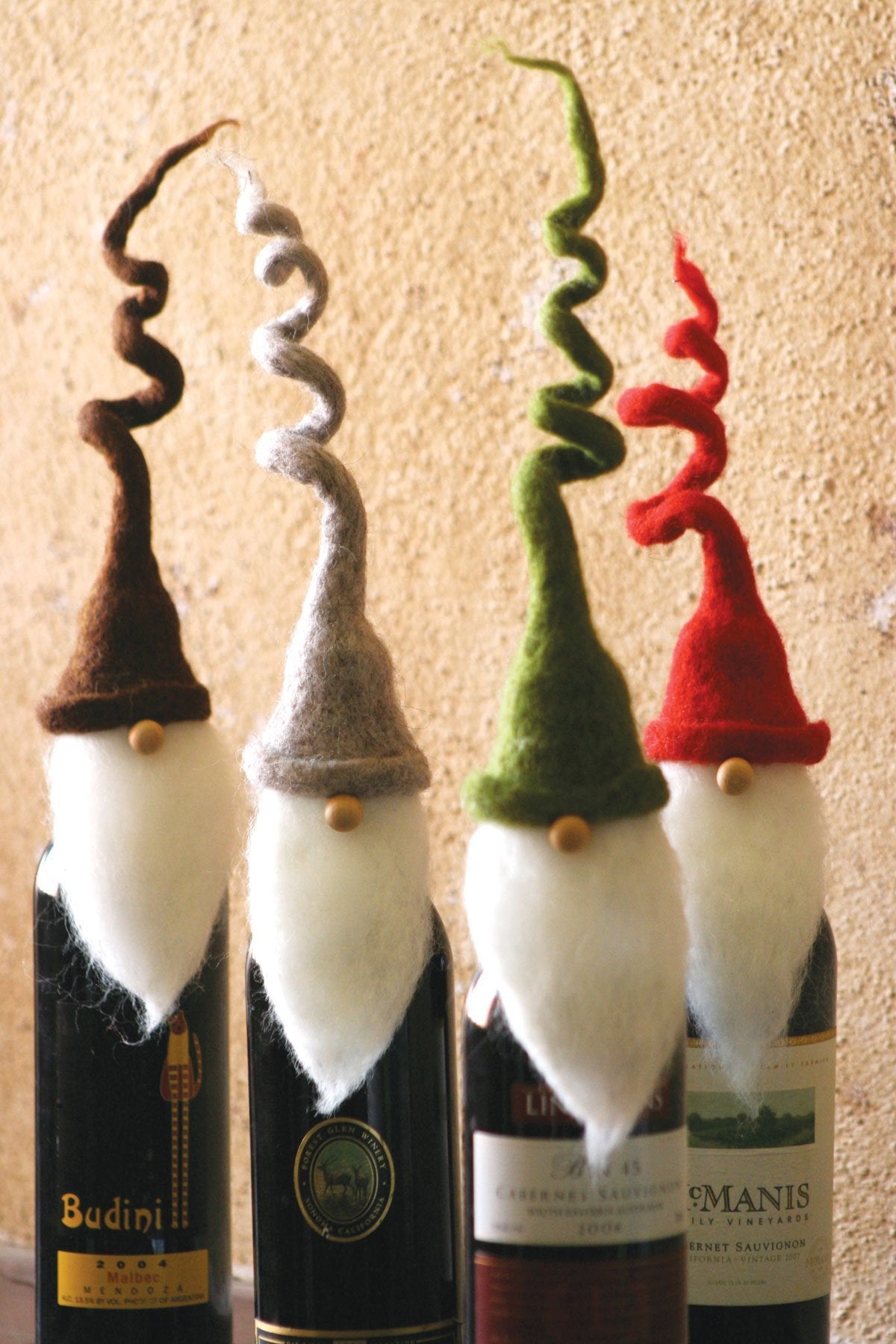 Set/4 Santa Wine Bottle Cover Toppers with Twirly Hats