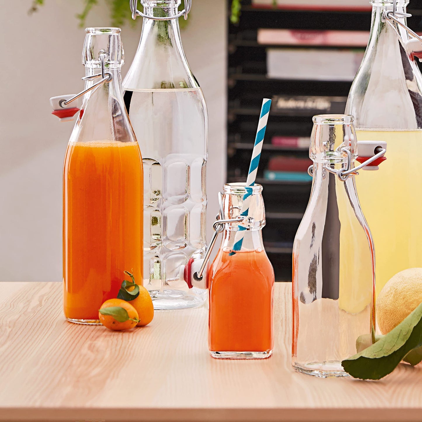 Bormioli Rocco Swing Top Glass Bottle (Set of 4) - Reusable Container with Secure Metal Clasp, Ideal for Homemade Juices, Oil Infusions, Condiments, Mixers - Everyday Drinking Glasses