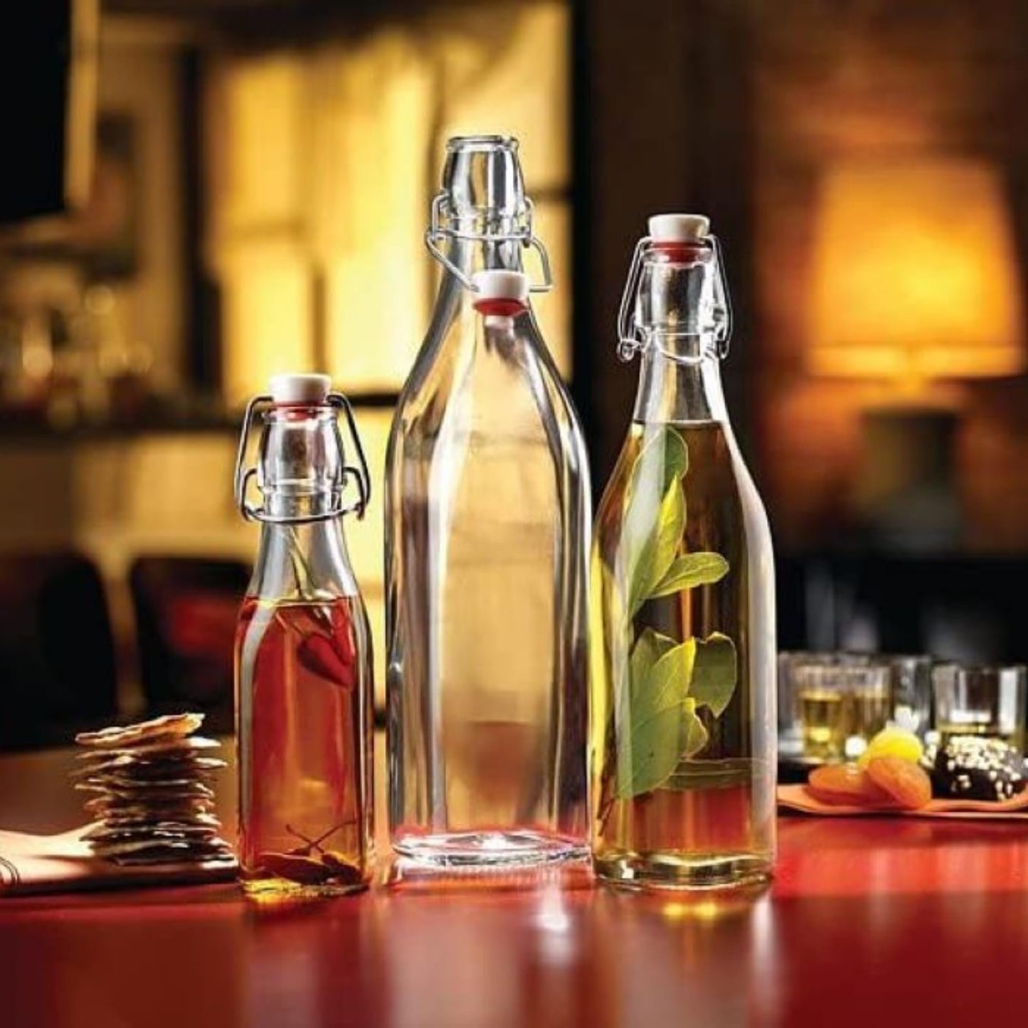 Bormioli Rocco Swing Top Glass Bottle (Set of 4) - Reusable Container with Secure Metal Clasp, Ideal for Homemade Juices, Oil Infusions, Condiments, Mixers - Everyday Drinking Glasses