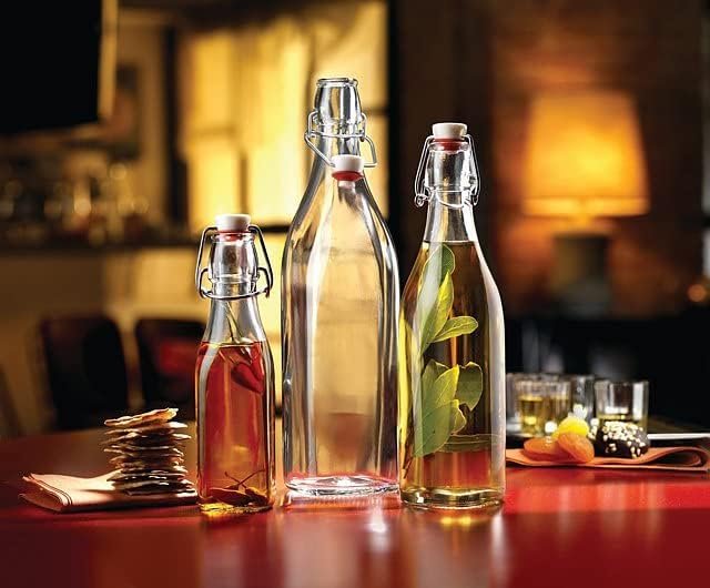 Bormioli Rocco Swing Top Glass Bottle (Set of 4) - Reusable Container with Secure Metal Clasp, Ideal for Homemade Juices, Oil Infusions, Condiments, Mixers - Everyday Drinking Glasses