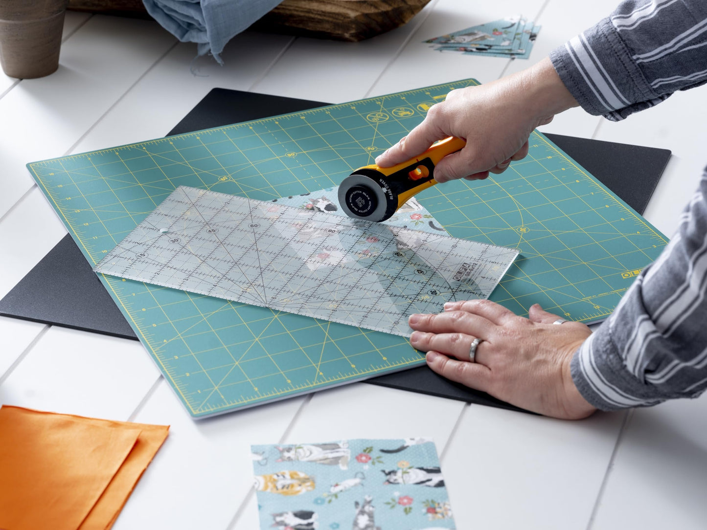 17"x17" (New) OLFA Rotating Cutting Mat - Self Healing Square Rotary Mat with Grid for Fabric, Sewing, Quilting, & Crafts, Rotates 360 Degrees, Use with Rotary Cutters