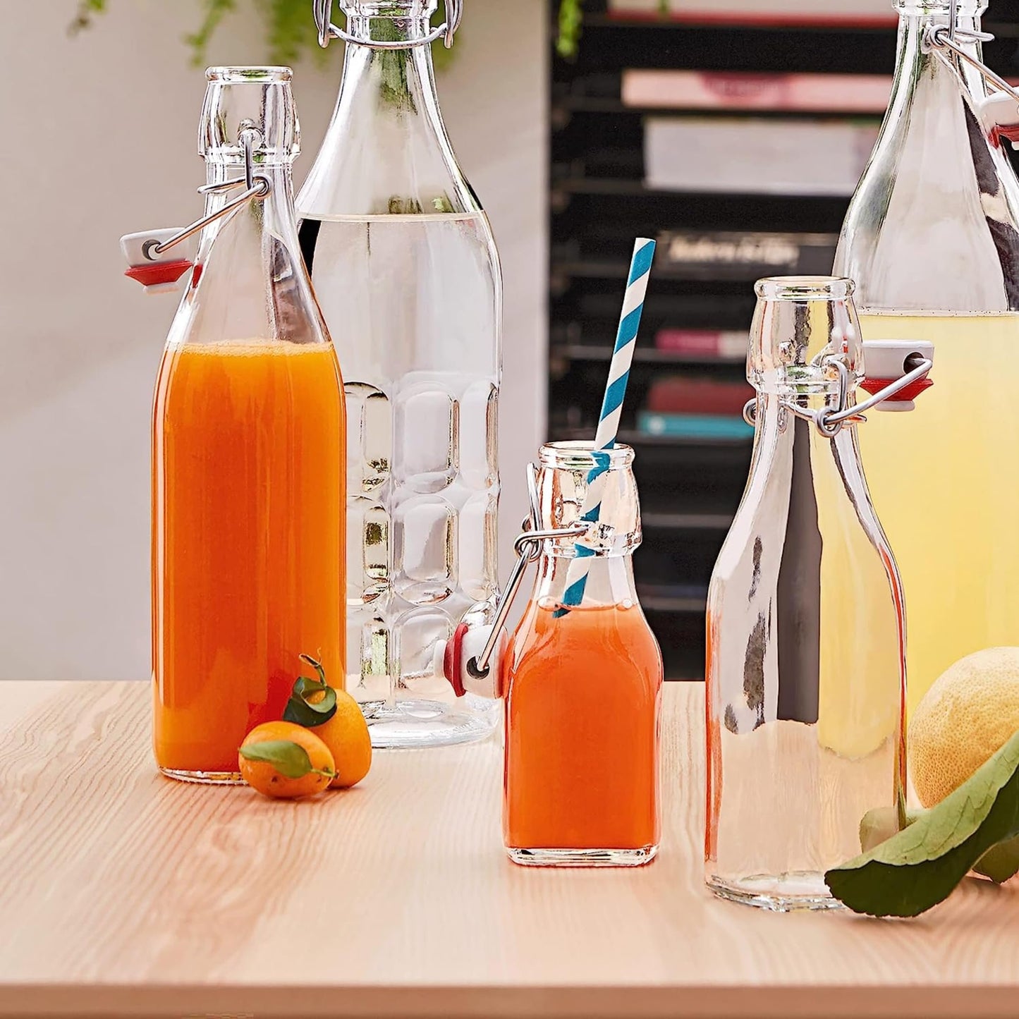 Bormioli Rocco Swing Top Glass Bottle (Set of 4) - Reusable Container with Secure Metal Clasp, Ideal for Homemade Juices, Oil Infusions, Condiments, Mixers - Everyday Drinking Glasses
